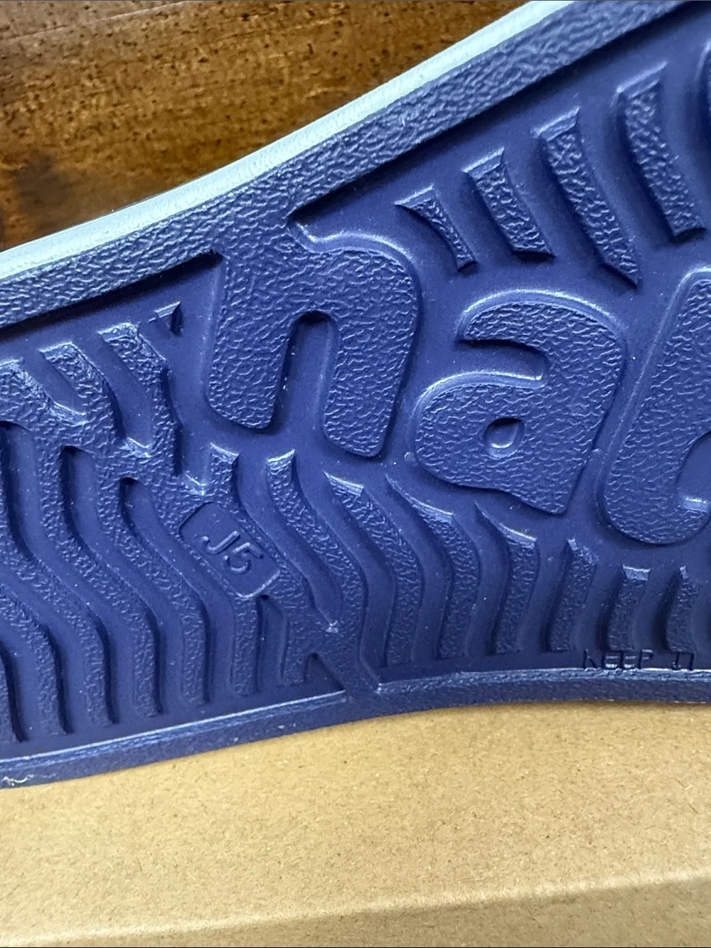 Kids NATIVE Jefferson Slip-On Sneakers in Navy with White Toe